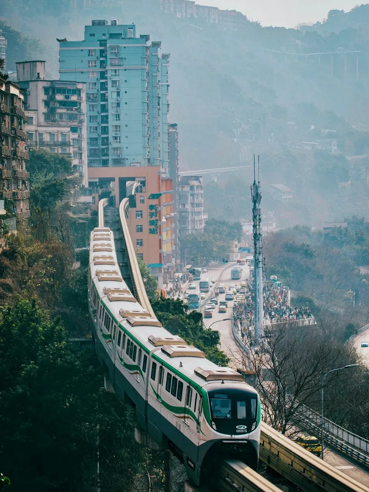 Chongqing Line 2 monorail emerging from the Liziba building on a hillside